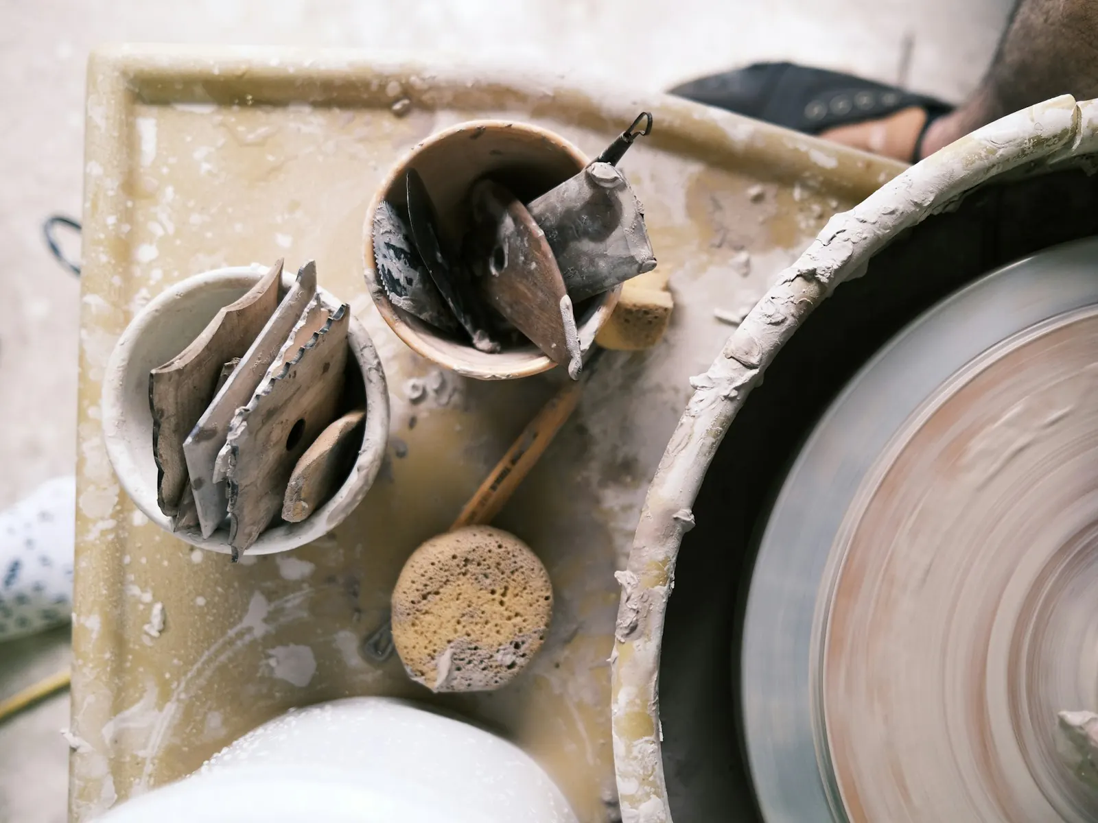 A potter's wheel and tools in a ceramics studio