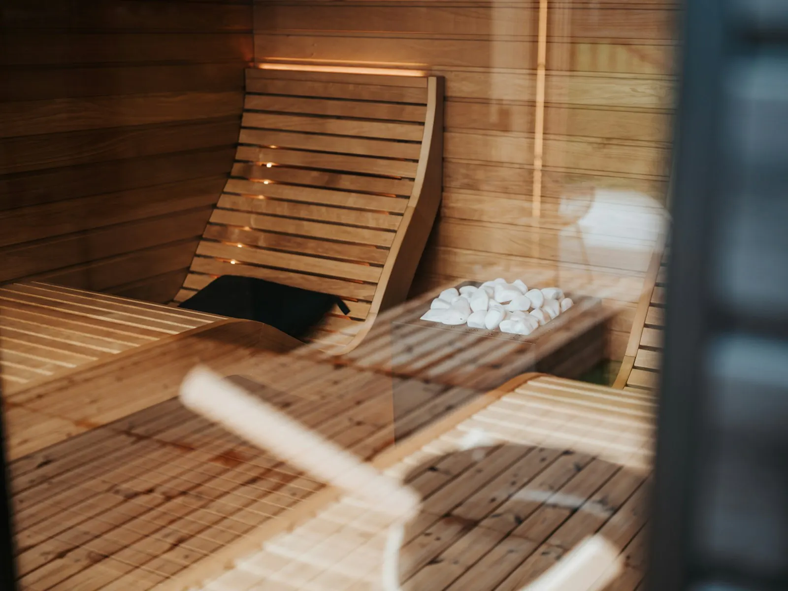 A wooden lounger in a quiet sauna room